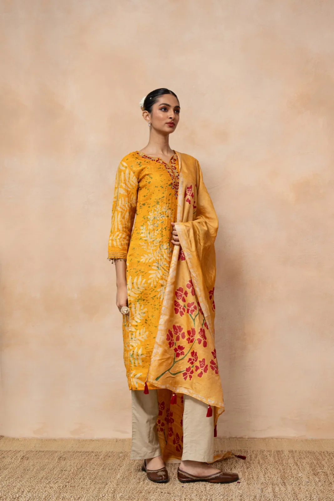 Swarnima – Mustard Hand Batik Tussar Silk Kurta Set with Floral Dupatta